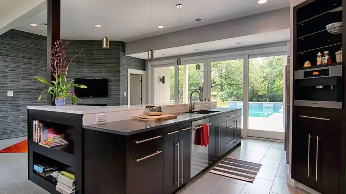 A kitchen with a large window and a pool