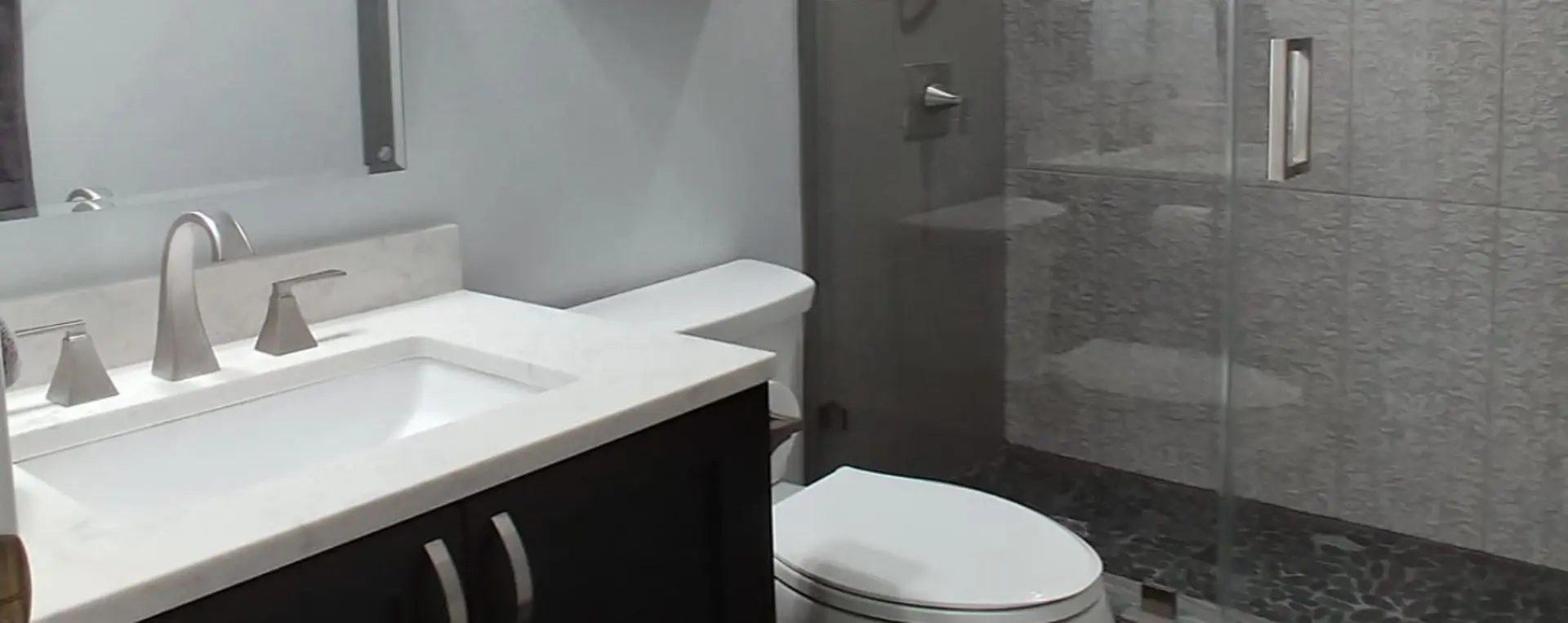 A bathroom with a toilet and sink in it