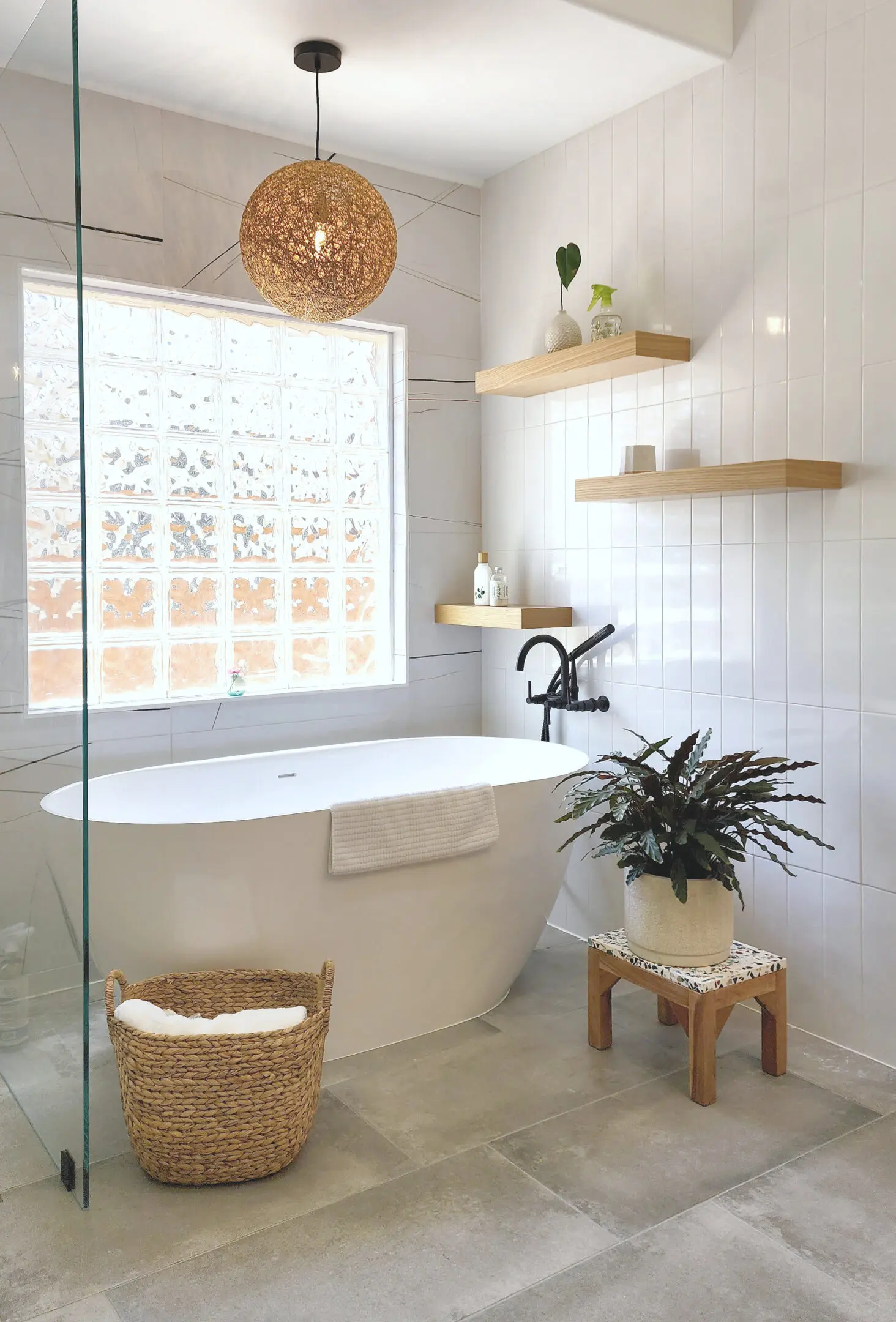 Contemporary soaking tub area added into this Circle C bath remodel