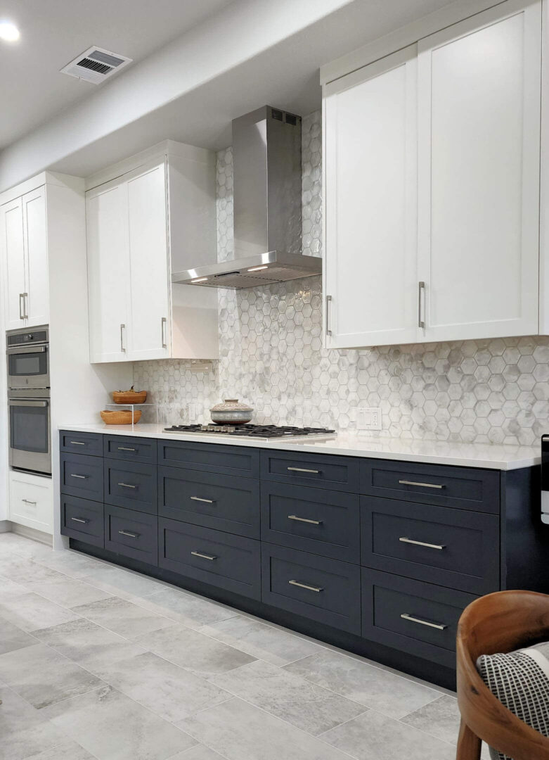 Renovation of the cooktop wall, with new shaker style cabinets in a Circle C Ranch home